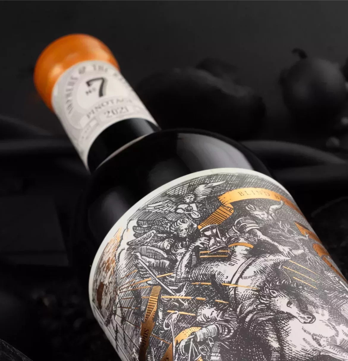 Richly coloured close-up of No. 7 Pinotage wine bottle and label